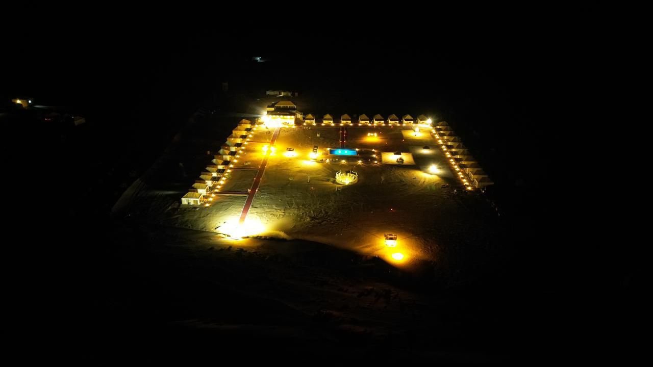 Aerial night view of Sahara Royal Resort luxury desert camp, Merzouga Morocco