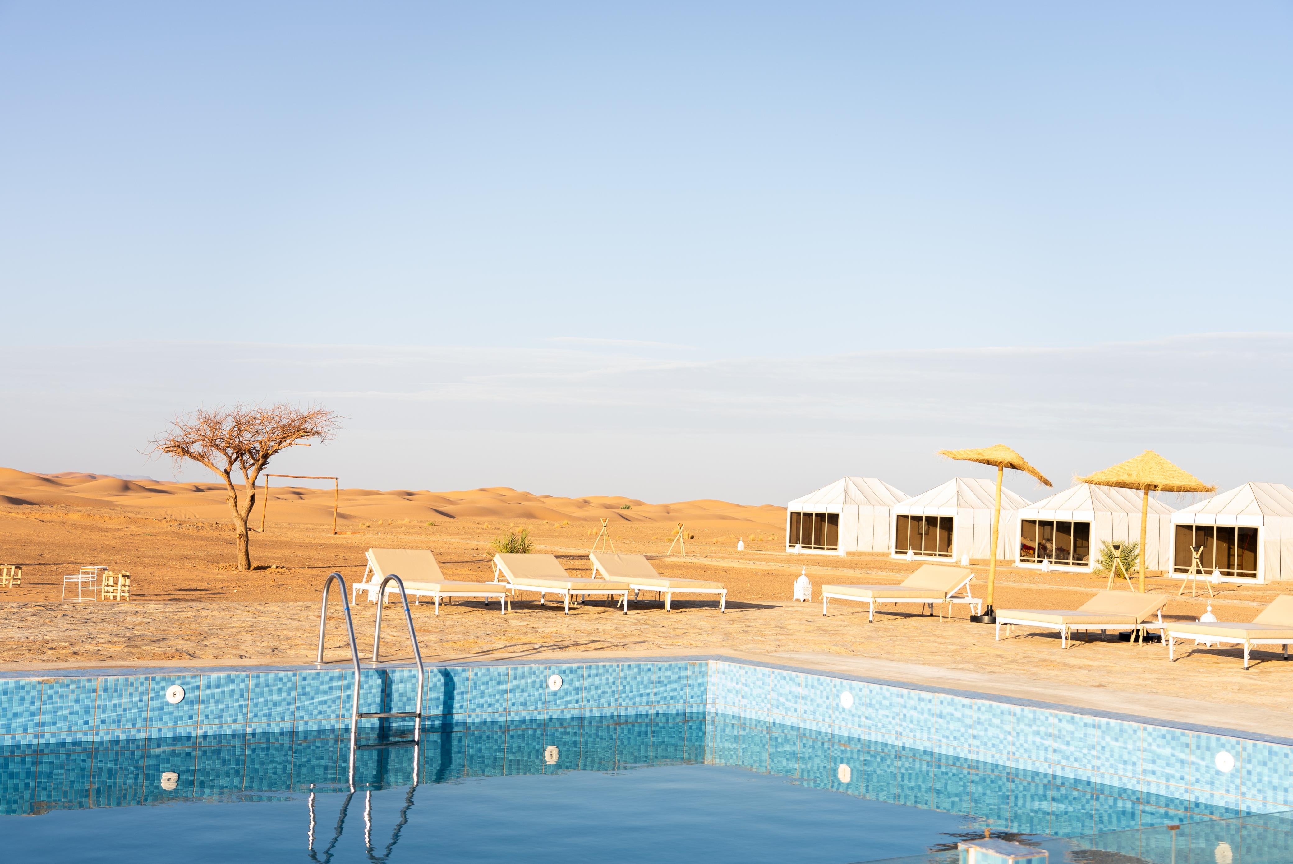 Outdoor pool at Sahara Royal Resort – luxury Merzouga desert camp Morocco