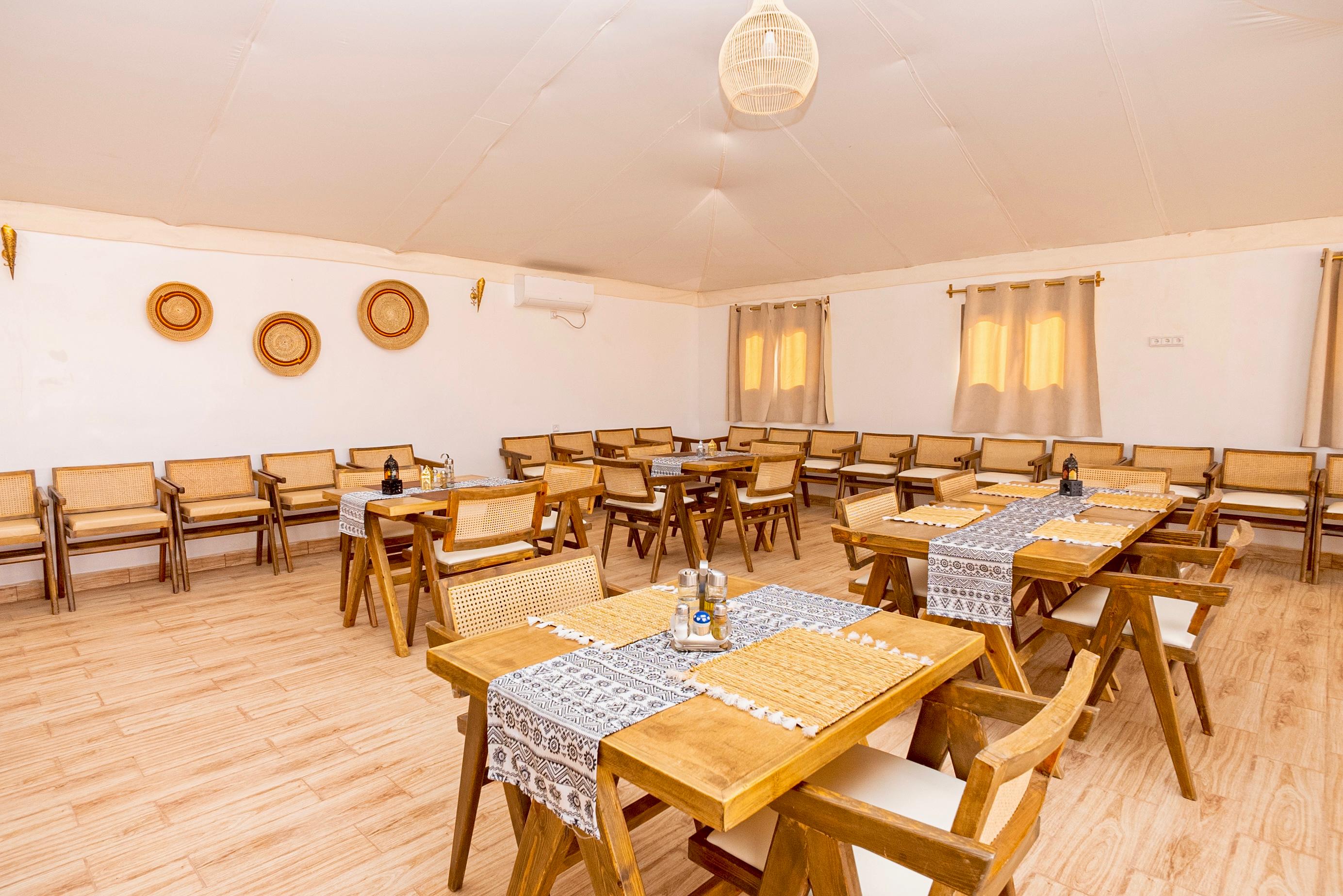 Authentic Moroccan tagine cuisine served at Sahara Royal Resort desert camp